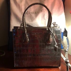 Michael Kors silver purse would make a great gift